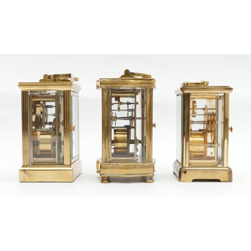 703 - Three mid to late twentieth century brass carriage clocks, having enamelled dials and featuring Roma... 