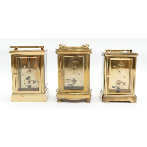 703 - Three mid to late twentieth century brass carriage clocks, having enamelled dials and featuring Roma... 