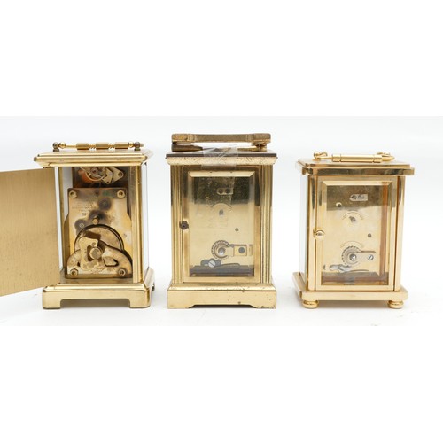 704 - Three mid to late twentieth century brass carriage clocks, having enamelled dials and featuring Roma... 