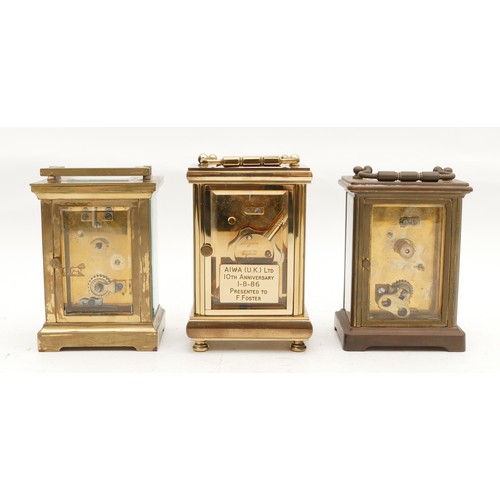 705 - Three mid to late twentieth century brass carriage clocks, having enamelled dials and housing 8 day ... 