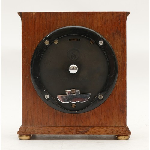 714 - An Elliott of London bracket clock, oak-cased with a silvered dial featuring Roman Numerals, and hou... 