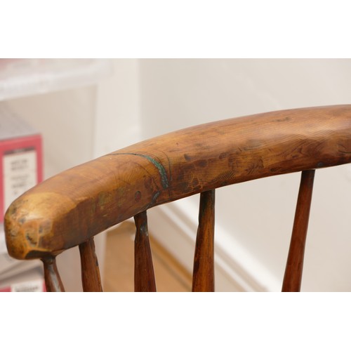 726 - An 18th century Welsh style primitive stick chair, elm seat with three holes to the top rail, 60cm a... 