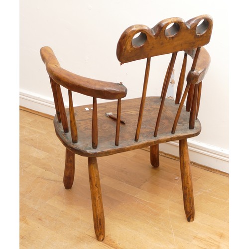 726 - An 18th century Welsh style primitive stick chair, elm seat with three holes to the top rail, 60cm a... 