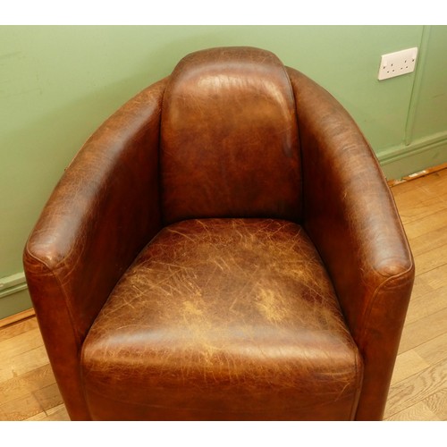 738 - After Timothy Oulton; A contemporary 21st century aviator 'Tomcat' style arm/tub chair, the curved s... 