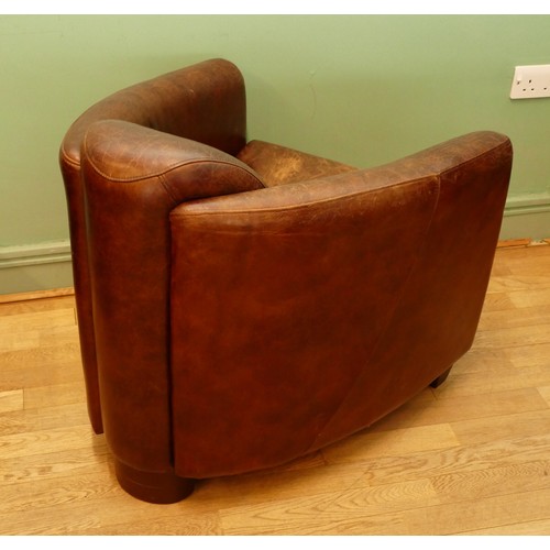 738 - After Timothy Oulton; A contemporary 21st century aviator 'Tomcat' style arm/tub chair, the curved s... 