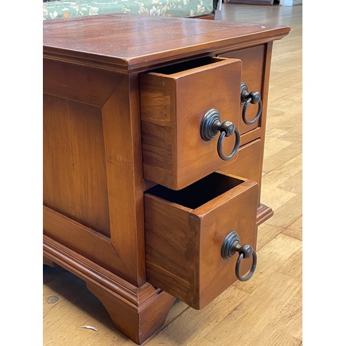 739 - A small modern hardwood chest fitted with four drawers, having antique styled brass drop handles, ra... 