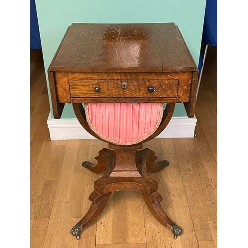 742 - A Victorian oak sewing table, having drop-leaf top, with single frieze drawer and slide out storage ... 