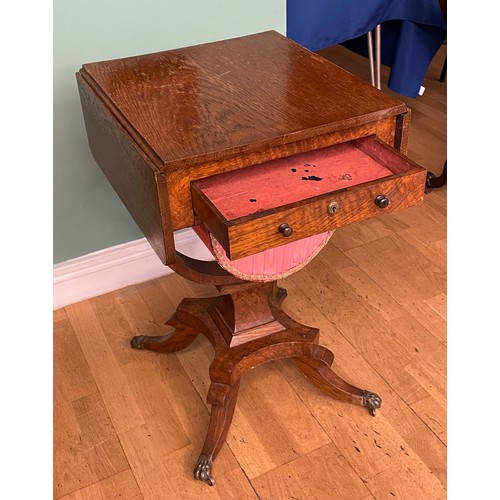 742 - A Victorian oak sewing table, having drop-leaf top, with single frieze drawer and slide out storage ... 