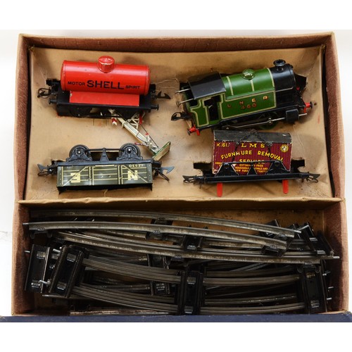 6 - Hornby Railways; A boxed Hornby 0 gauge clockwork model railway set, No. 201, together with a quanti... 