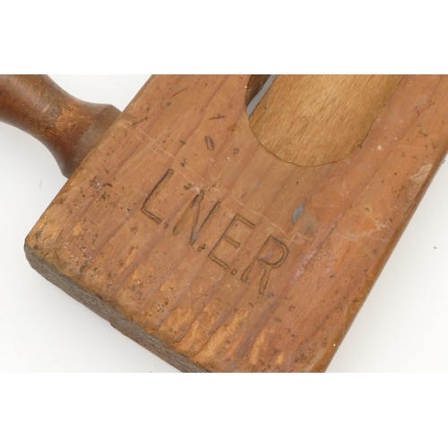 16 - A LNER stamped line side warning rattle/clacker, together with a fruitwood police rattle/clacker and... 