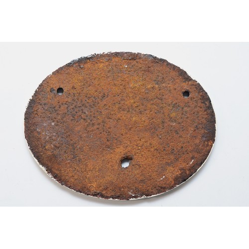 24 - An oval cast-iron builders plate, G.E.R. Stratford Works 1884.