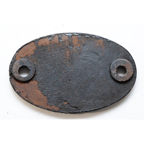 34 - An oval cast-iron shedplate, 9D Buxton.