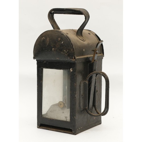 51 - An LMS Railway lantern, with the logo embossed in red, complete with burner, H-28cm.