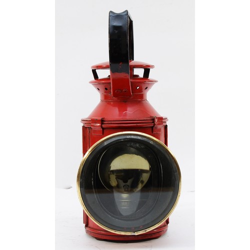 63 - A red B.R. three-aspect handlamp, complete with burner.