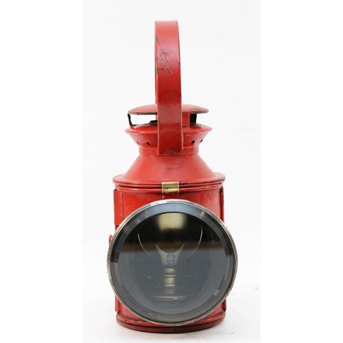 70 - A red London Transport (L.T) three-aspect handlamp, complete with burner.