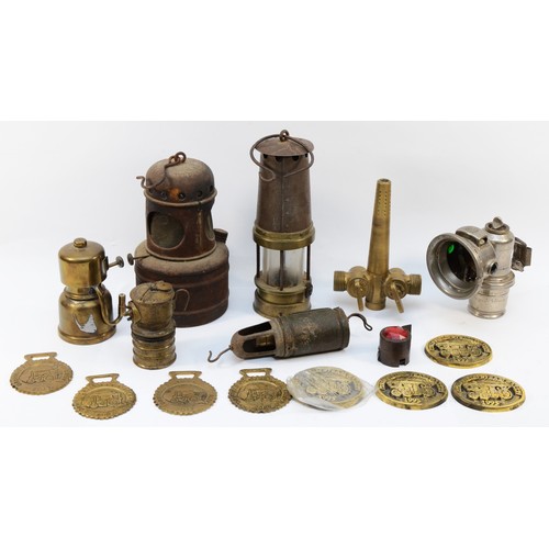 143 - An assortment of brass metalwares, to include, a Miners Lamp, a Joseph Lucas cycle lamp, and Driffie... 