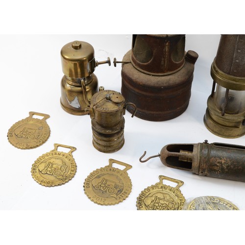 143 - An assortment of brass metalwares, to include, a Miners Lamp, a Joseph Lucas cycle lamp, and Driffie... 