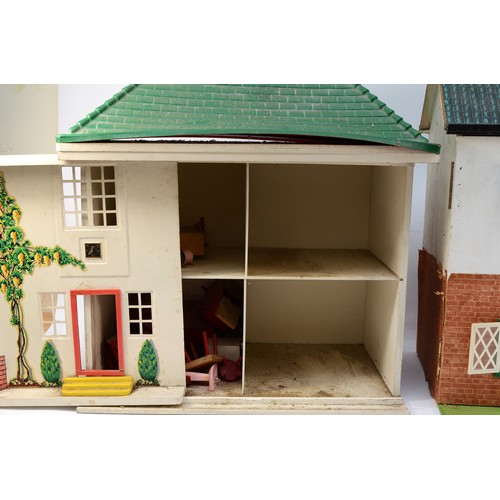 144 - Two 1960s dolls houses, of wood and metal construction with contents including furniture and accesso... 