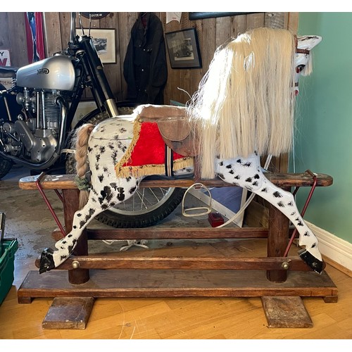 146 - A mid-twentieth century dapple grey rocking horse, on a trestle rocker frame and plinth base, H-103c... 