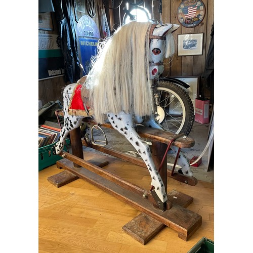 146 - A mid-twentieth century dapple grey rocking horse, on a trestle rocker frame and plinth base, H-103c... 