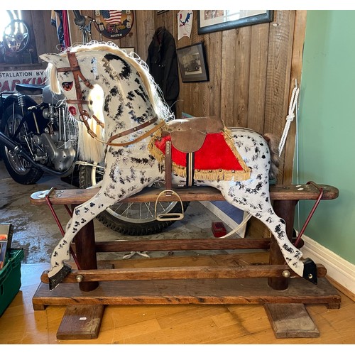 146 - A mid-twentieth century dapple grey rocking horse, on a trestle rocker frame and plinth base, H-103c... 