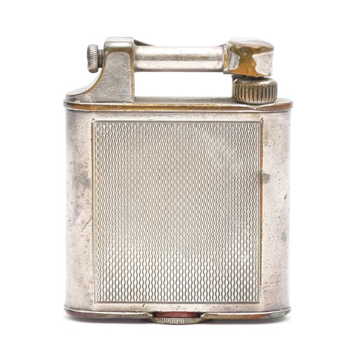 Alfred Dunhill; A 1930s Dunhill 'Unique' lift arm pocket cigarette lighter, petrol filled, silver plated casing with engine turned decoration, boxed with instructions.