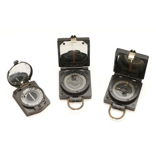 396 - WWII three Bakelite military compasses, to include two Magnetic Marching MK1 T.G Co., patented B1632... 