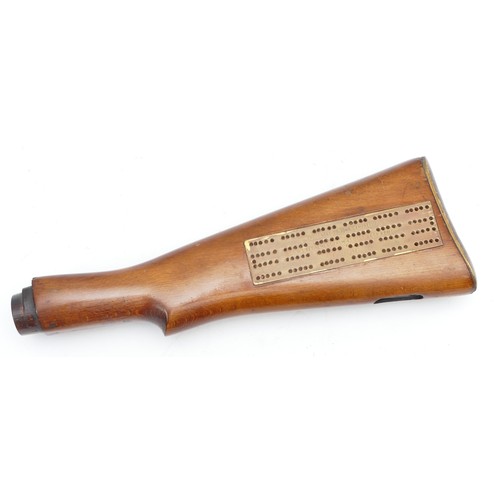 406 - A Cribbage game reinvented into into the buttstock of a rifle, presented to John Campbell in 1987.