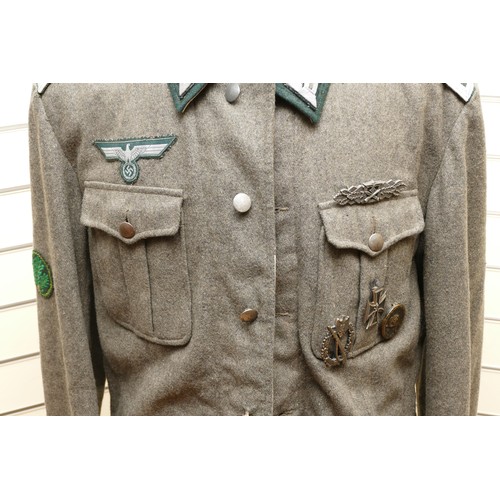 415 - WWII German Third Reich M42 Army (Heer) Field Blouse, With various badges attached, to include the C... 