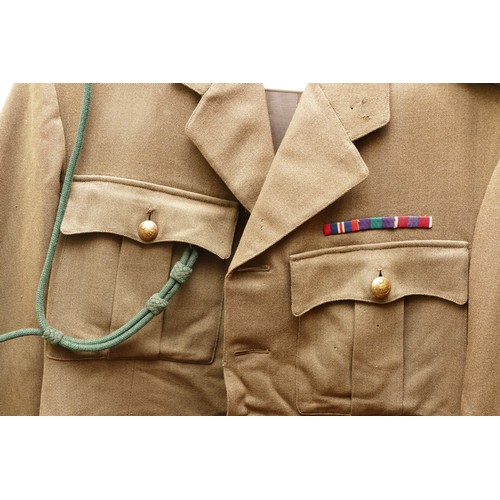 422 - Two British military uniforms, including a WWII captains tunic, 87 x 49cm with a post war tunic and ... 