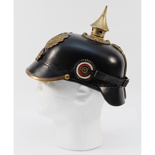 425 - A WWI German/Prussian Imperial Spiked Pickelhaube helmet, the brass front displaying the spread-wing... 