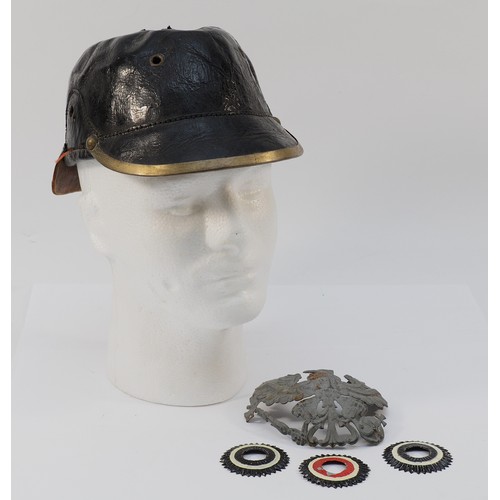 426 - A WWI German/Prussian Pickelhaube helmet, missing its spiked top and leather chin strap, with a trio... 