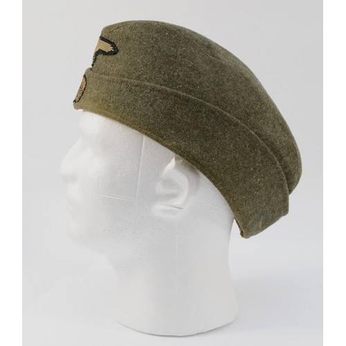 427 - A WWII German Third Reich Waffen-SS Cap, embroidered with the BeVo SS eagle with swastika, the death... 