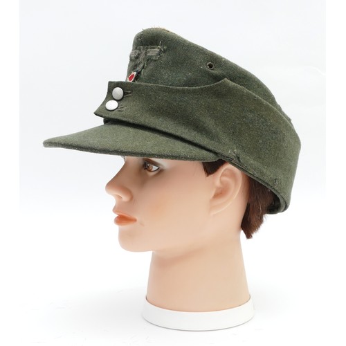 430 - A WWII German Third Reich M43 cap, embroidered with the eagle with swastika, manufactured by Clemens... 