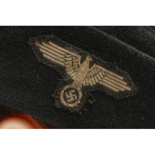 432 - A WWII German Third Reich Waffen-SS Cap, embroidered with the BeVo SS eagle with swastika as well as... 