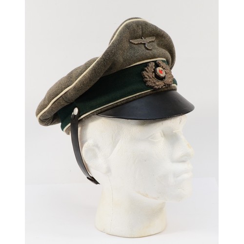 433 - WWII German Third Reich Medical Officers visor cap, embroidered with the eagle and swastika, manufac... 