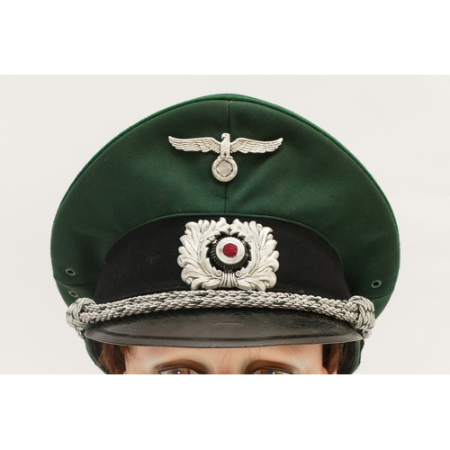 435 - WWII German Third Reich Officers green visor cap, embroidered with the eagle, swastika removed and w... 