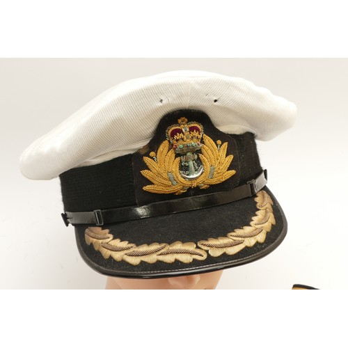 438 - ERII Royal Navy visor cap, manufactured by Paisley's Limited, interior roam leather and behind the q... 