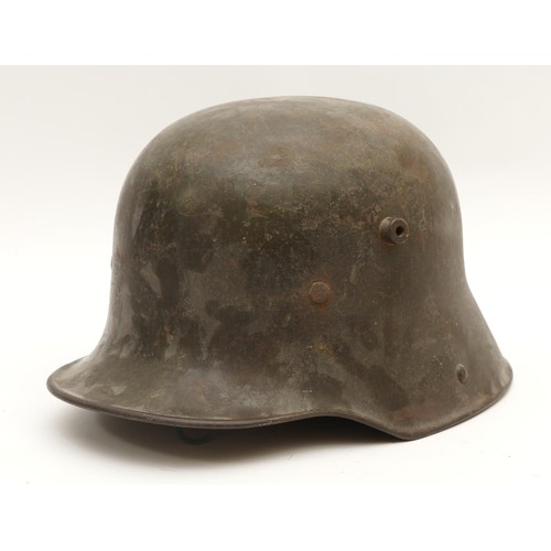 453 - WWI German Machine Gunners helmet, marked SI.66, with original leather interior but damaged.
This is... 