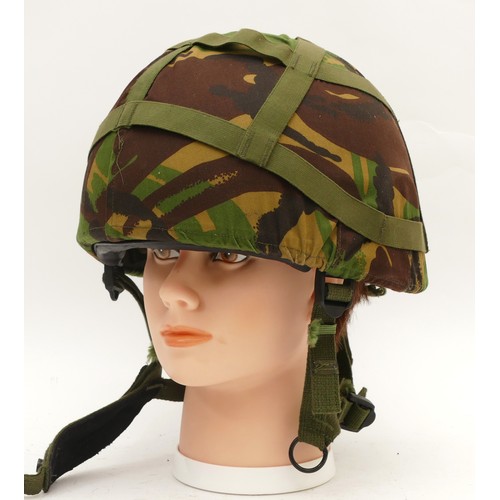 463 - A NATO stock combat helmet, GS Mk 6 1988/90, size medium, by N.P. Coventry, with camouflage cover