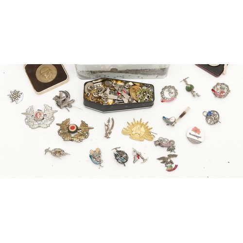 472 - WWII A large collection of reproduction pin badges, together with ribbons and coins to include the P... 