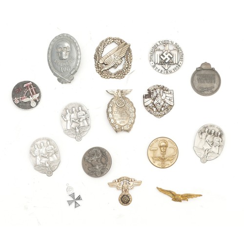 475 - WWII collection of fifteen reproduction medals and cap badges, to include the Sturmbaoh 106, marked ... 