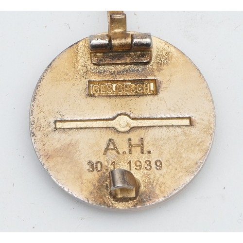 476 - WWII German Third Reich NSDAP gold party badge, makers name Ges Gesch, marked A. H. 30.1.1939.