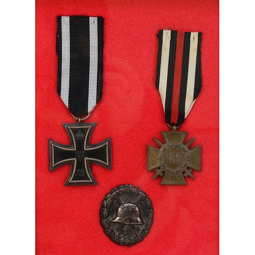 517 - WWI 1914 2nd Class Iron Cross, together with the 1914-1918 Honour Cross with swords and a black Impe... 