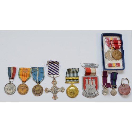 518 - A collection of eleven replica medals, to include the Distinguished Flying cross, Korea, miniatures ... 