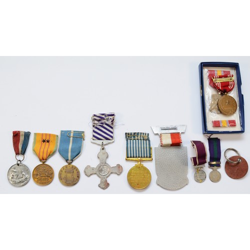 518 - A collection of eleven replica medals, to include the Distinguished Flying cross, Korea, miniatures ... 