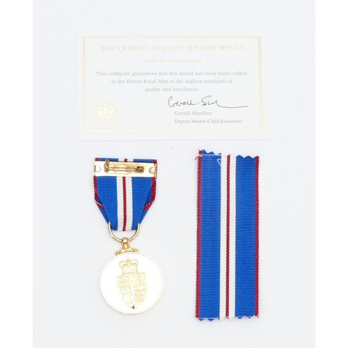 544 - A boxed Elizabeth II Golden Jubilee medal, with certificate of authentication.