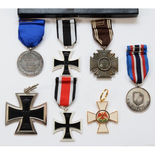 588 - A collection of seven medals, to include the Third Reich NSDAP 10 Year Service, together with replic... 