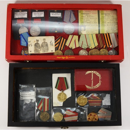 589 - A large collection of Soviet Russian medals, to include the Meritorious Service In Combat, Type one ... 