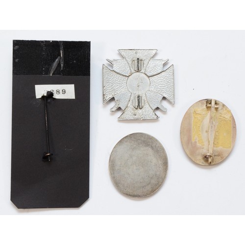 591 - A collection of four badges and medal, including a replica 5th Guards Don Coassack Cavalry Corp meda... 